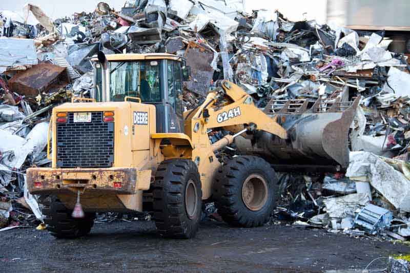 collecting scrap metal from pile