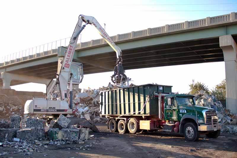 Container being filled with scrap metal