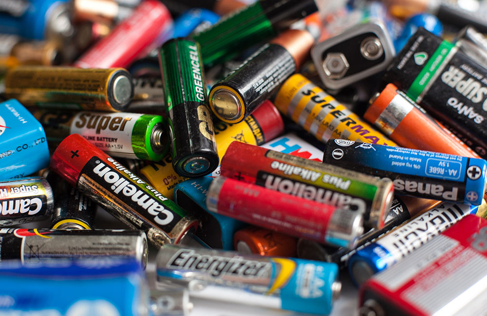 Color batteries of different sizes on a white background