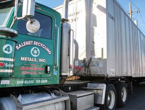 side angle of an H&C Metals truck used to pick up scrap metal